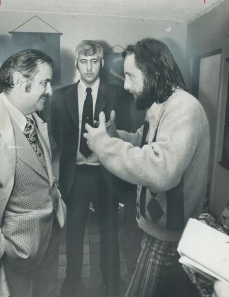 York mayor Philip White talks with a resident of Rochdale College, George Metley, while security officer Joseph Crocco stands by (centre)