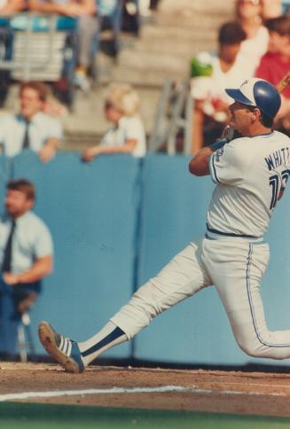 Home-run swing: Catcher Ernie Whitt of the Blue Jays watches the ball he hit clang off the rightfield foul pole for the game-winning home run yesterday that beat Texas Rangers, 8-7
