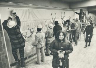 Caribou prance in subway. Artist Joyce Wieland stands in front of the wall-hanging she created for new Spadina subway line station on Spadina Rd. near(...)