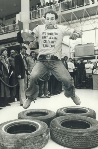 Flipped out. Dave ''Tiger'' Williams helped the Toronto Maple Leafs taste victory yesterday over the Toronto Argonauts in a pancake race to raise money for the Big Brothers
