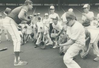 Is one of these kids a future Hall of Famer? A baseball clinic for future George Bells and Jimmy Keys, sponsored by Chiquita bananas, was part of yest(...)
