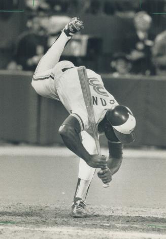 Blue Jay outfielder Mookie Wilson finds himself top to bottom as he dodges a too-close pitch yesterday against Cleveland. The Jays won 2-1 and Baltimo(...)