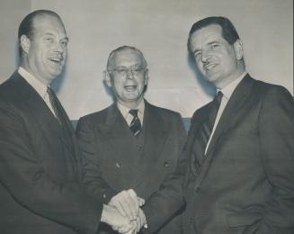 Robert Winters, left, former minister of public works in the Liberal cabinet, is congratulated by Premier Frost and Dr. Claude Bissell, right, after a(...)
