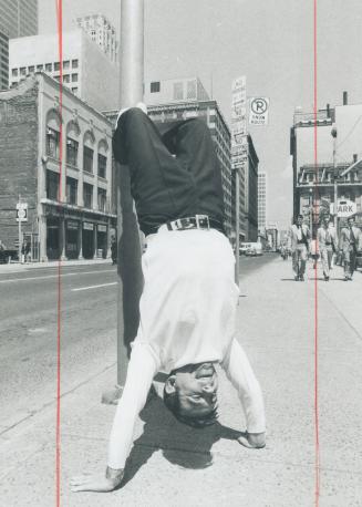 Upside down man at the corner of Yonge and Front Streets this week was British music hall comic Norman Wisdom, proving his point that he's still nimbl(...)
