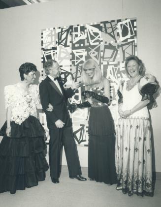 AGO Director William Withrow discusses a black and white painting