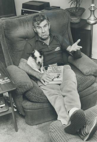 Trouble finds him: Peter Worthington sits at home with his terrier, Lucy, and the new book he was promoting in Western Canada when he talked himself out of a job