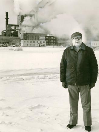 Reed pulp and paper mill, target of pollution critics, behind Bill Saskoley, one of 7,000 Dryden residents