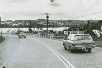 Boom time or gloom time, Elliot Lake, unlike many mining towns, is a planned, peaceful, and clean place near a lake with a backdrop of wooded hills