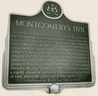 Square plaque with engraving of shield above text featuring three maple leaves in centre, a moo…