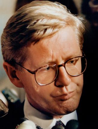 Grim Leader: Premier Bob Rae faces reporters yesterday after cabinet ministers Anne Swarbrick and Shelley Martel offered him their resignations