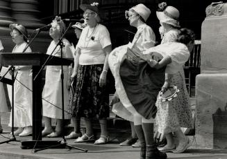 They're raging: Members of the Raging Grannies perform at a Queen's Park rally yesterday before a march to Ontario Hydro headquarters