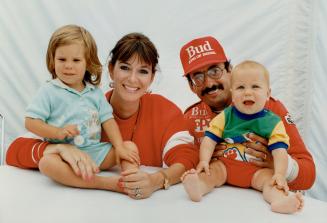 Cart wheels: Debi and Bobby Rahal pose with Michaela, 2 1/2, and Jarrad, 7 months
