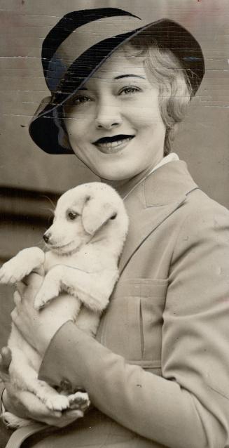 Famous Sally Rand, fan dancer, here with dog, Mamie