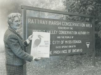 Rattray fund drive starts. Dr. Ruth Hussey, president of the Rattray Marsh Preservation Committee, shows campaign poster as the organization starts it(...)
