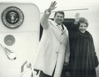 U.S. President Ronald Reagan and his wife, Nancy, wave goodbye as Mila Mulroney reacts to the noise of their jet