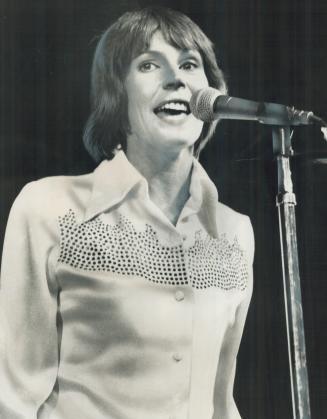 One of the littlest heavyweights in the big league of showbiz is how Star staff writer Jack Miller describes Helen Reddy in review of her concert at t(...)