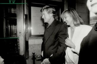 Robert Redford and his friend 'Cathy' make their way to the screening at the Eigin theatre on Yonge St