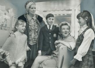 Starry-eyed, the children of Mr. and Mrs. Phil Harrison talk with Beryl Reid in her dressing room at the O'Keefe Centre. Left to right are: Frances, 6(...)