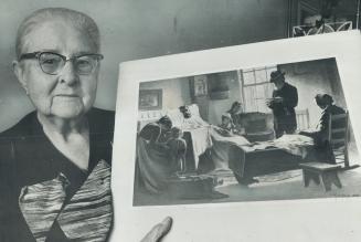 Mrs. George Stephenson, 87-year-old Willowdale woman holds a print of G.A. Reid's painting 'Foreclosure of the Mortgage' for which she was one of the (...)