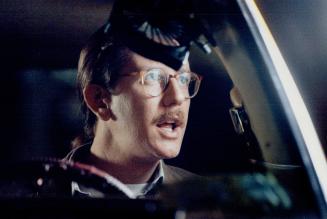 Hackin' it: Judge Reinhold sits behind a fan at the wheel of his taxi in Baby On Board being filmed in Toronto, while co-star Carol Kane gets dumped in a rat-infested garbage dumpster