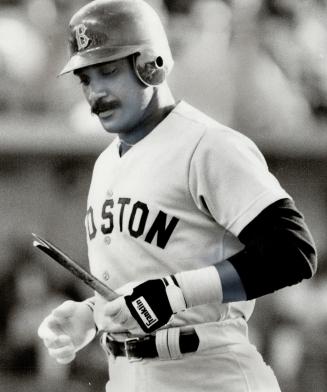 This is junk: After breaking his bat, Jim Rice appears to be saying to himself 'they don't make them like they use to' during first inning appearance of last night's game