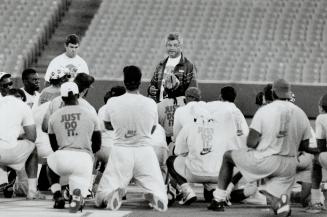Listen up: Argonaut players, wearing Nike T-shirts with the appropriate Just Do It slogan, get a stern talk from coach Adam Rita yesterday