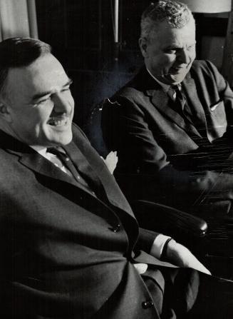 Laughing 'Conservatively,' Ontario Premier John Robarts and federal Opposition Leader John Diefenbaker confer in Mr