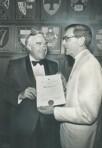 John Robarts, former premier of Ontario, became an honorary fellow of the provincial Academy of Medicine last night at a dinner and ball held at Hart (...)