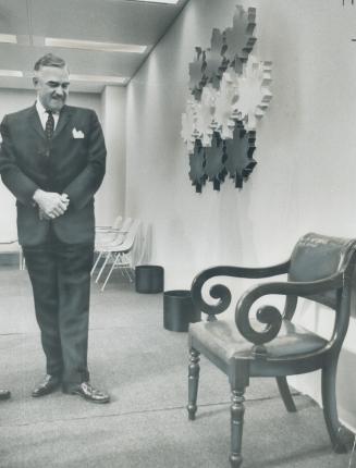 On Eve of the confederation of Tomorrow conference, Premier John Robarts examined the chair, brought from Charlottetown, on which Sir John A. Macdonal(...)