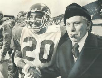 Ordinary superstar Johnny Rodgers, shown shaking hands with Montreal Alouettes owner Sam Berger after last Saturday's victory over Ottawa, will be man(...)