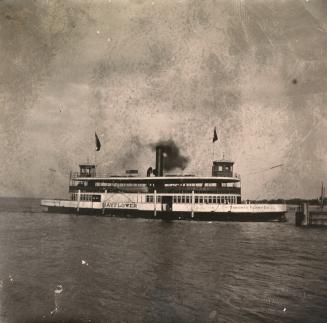 Image shows a ferry boat on the lake.