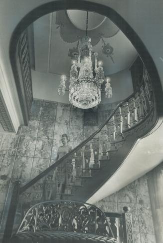 Antique Chandelier from Nizam of Hyderabad's palace dominates foyer of the 17-room home in Unionville