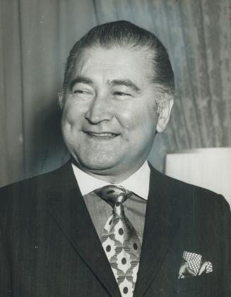 A smiling Stephen Roman, chairman of Denison Mines, announces uranium stockpiling deal yesterday which will keep 900 Elliot Lake miners working until (...)