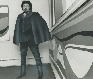 William Ronald with one of his three-canvas paintings at dunkelman Gallery