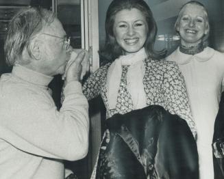Mickey Rooney plays the gallant at Malton Airport with hand kiss for Suzanne Charron and Louise Carmel from Montreal