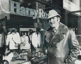 Striking Napoleonic Pose, Harry Rosen stands at Bloor and Bay outside his newest meanswear outlet