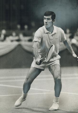 Over the hill? Ken Rosewall, displaying fine backhand during action at CNE Coliseum, delights in confounding experts who suggested he was getting too (...)
