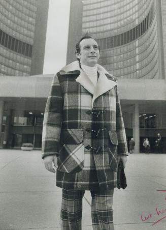 Plaid duffle coat. Rotenberg wears it in front of City Hall