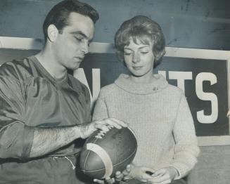Argonaut Jim Rountree gives football tips to Amy Croake