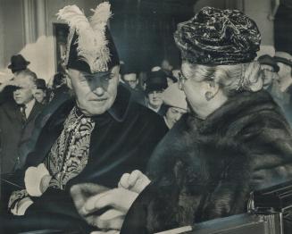 Ready to roll: Lt.-Gov. and Mrs. Rowe sit in their landau outside the Royal York hotel waiting for the parade up University Ave. to get underway. Bene(...)