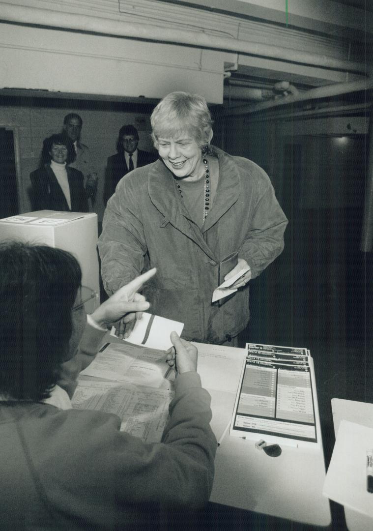 She's the mayor: June Rowlands casts her ballot yesterday morning, on her way to handily defeating Jack Layton in the bitterly contested Toronto mayoral race