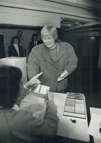 She's the mayor: June Rowlands casts her ballot yesterday morning, on her way to handily defeating Jack Layton in the bitterly contested Toronto mayoral race