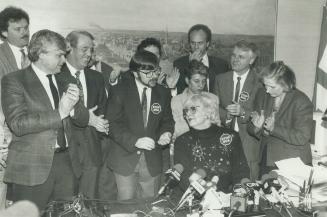 Taking a bow: Toronto Mayor June Rowlands, the tax plan's leading opponent, is applauded yesterday by councillors who share her stand