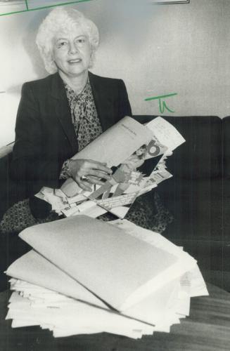 Porn pile: Toronto Alderman June Rowlands displays some of her arsenal of pornographic hate literature that she says helps promote violence against women