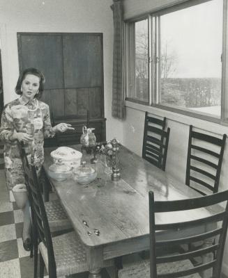 Table seats 8 but Mrs. Rubes adds another top to enlarge. Casseroles, glass serving bowls are favorite serving pieces when she has guests