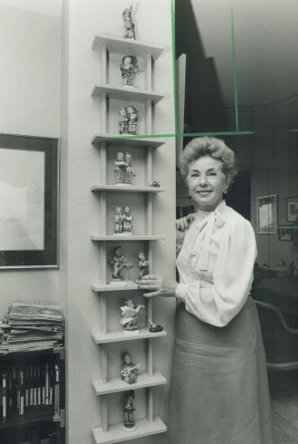 Susan Douglas Rubes has the family's collection of Hummel figurines displayed on a rack made by Jan