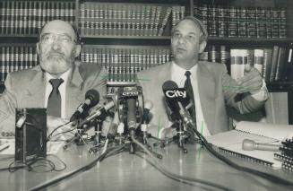Tough Stance: Dr. Henry Morgentaler, left, and lawyer Clayton Ruby tell reporters yesterday demonstrators should face stiffer charges for defying a ban on protests at his clinic