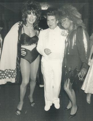 Craig Russell flanked by LaCage Auk Folles female impersonators