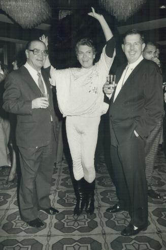 Left, boxing great Sammy Luftspring with Craig Russell, in pink tights and sequined matching top, and TV Ontario casting director George Bourne