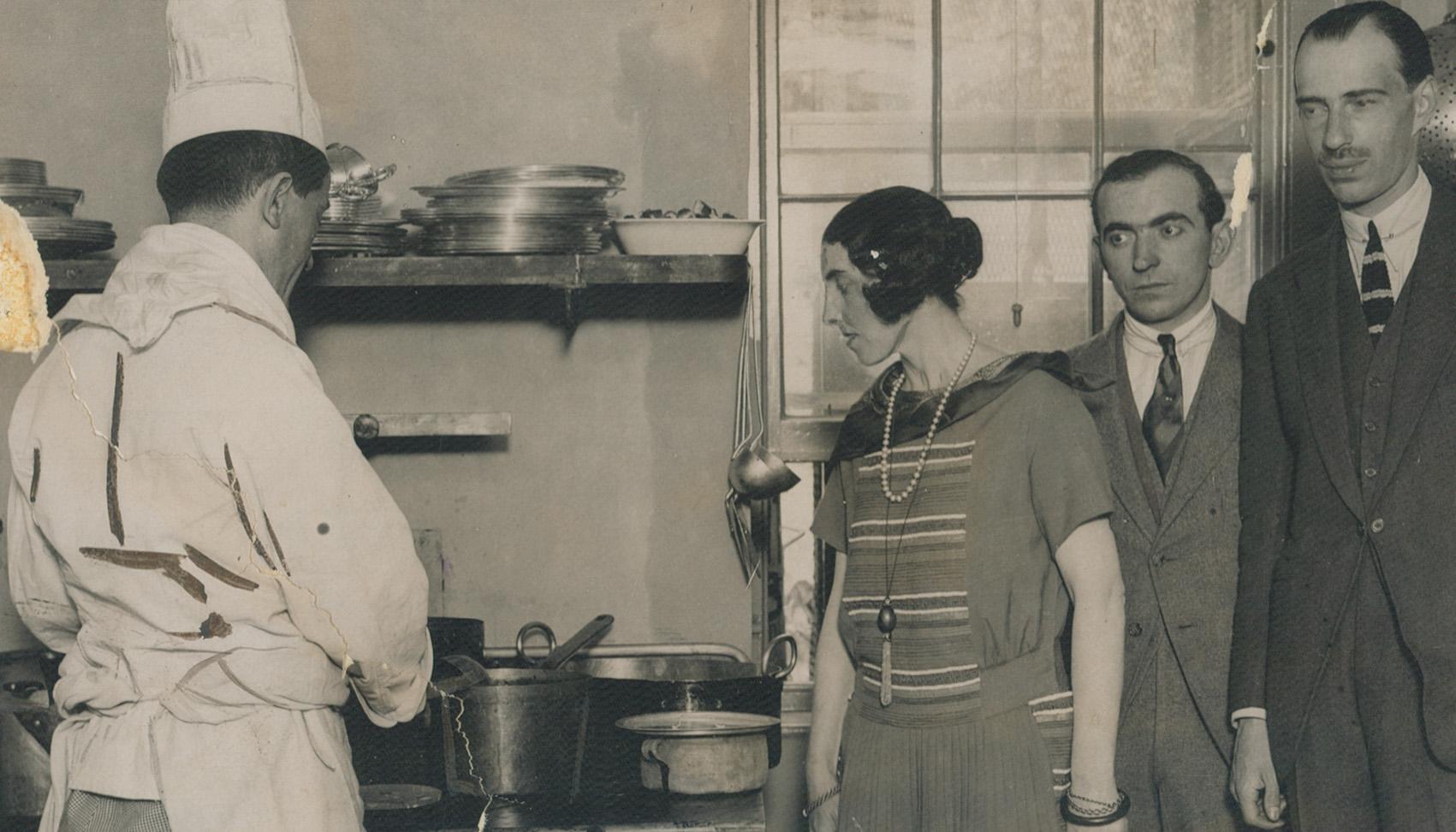Her son, Prince Andrew, and his wife are seen in the centre picture supervising the kitchen in a refugees' club